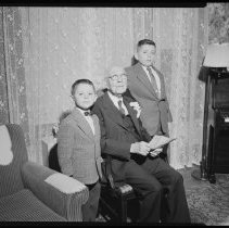 Elderly man with two boys