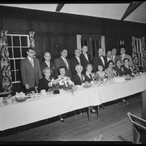Seventeen people at banquet table, 1955