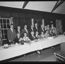 Seventeen people at banquet table, 1955