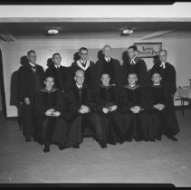 Eleven men in clerical robes