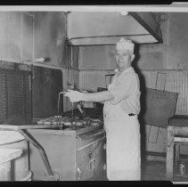 Baker John Hideriotis at Tasty-Fine Donut Company, Haverhill, ca. 1947