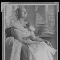 Cora Chase posing for a portrait to be painted by Marguerite Pearson, 1952