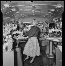 Allied Shoe Machinery Corp. Mobile Unit bus, woman demonstrating, 1954