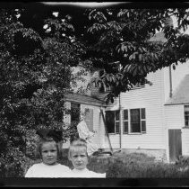Two young girls in front of a house - Palmer