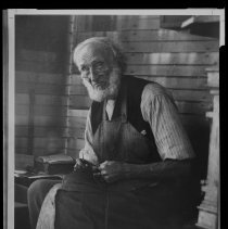 Cobbler John Murphy Sr. working on a sole