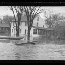 Flood, man in canoe, Haverhill