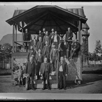 Eighteen men and boy at bandstand, group portrait