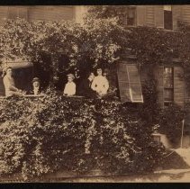 Five people on a porch, Daniel Fitts House, Cedar Street, Haverhill
