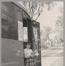 Haverhill Public Library Bookmobile, girl with books, Rocks Village, 1956