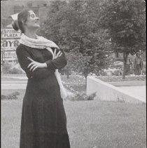 Two women pose outside in costumes for children's theater, 1973