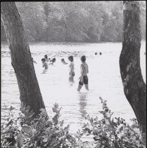 Children and teenagers cool off in Plug Pond, 1973