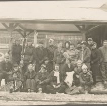 Group portrait of 21 people waiting for the Boston and Maine Snowtrain, 193