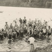 Large group of children and teenagers pose in the waters of Lake Saltonstal