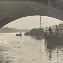 Coffer dam construction through arches of bridge, 1937