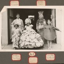 Children in costumes at an art show