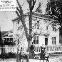 Baker house with people in front
