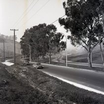 Two cars on newly rebuilt Tice Valley Boulevard, access to Rossmoor (Dollar Ranch)