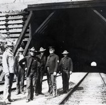 Six men standing at the entrance to the Santa Fe Railroad tunnel to Ferry Point