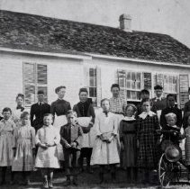 Students and teachers standing in front of Green Valley School