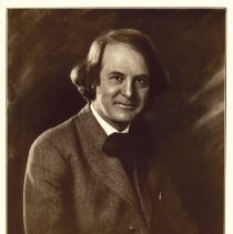 Elbert Hubbard seated.