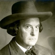 Elbert Hubbard seated wearing stetson.