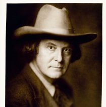 Elbert Hubbard seated wearing stetson.