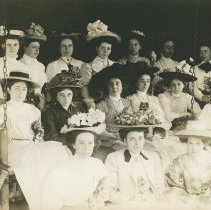 Roycrofters on a porch swing