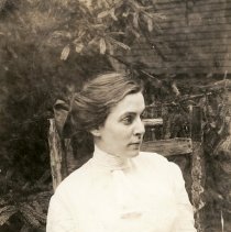 A Roycrofter seated on a chair.