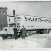 Ed Smart in front of a Smart Bros. Ltd delivery truck