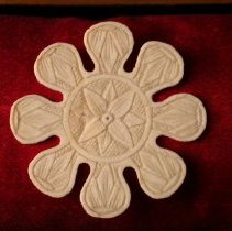 Carved, flower-shaped