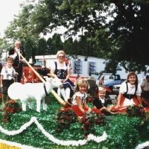 Delbert & Irene with children on Swiss Days float