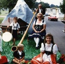 Delbert & Irene with children on Swiss Days Float