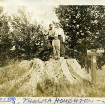 Charles, Jim, Thelma on elm tree stump