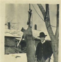 Perron Roberts and deer he shot hanging