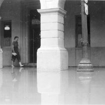 Flood of 1939 - 6th & Main St. El Centro. Woman walking barefoot along side