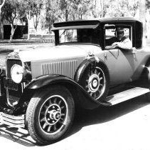 U.S. Customs officer sitting in his patrol car.
