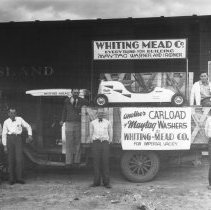 Whiting Mead Co. freight truck, loaded with crated washing machines, parked