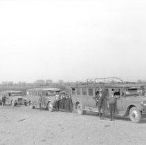 Borderland Transit Co. - Mack buses parked in desert.
