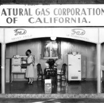 Natural Gas Co. of California - Fair display showing appliances. Woman putt