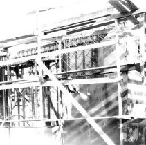 El Centro Library - Man spraying "Gunnite" base on a wall under Constructio