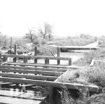 Holton Power Canal - Holtville. Headgate with wooden bridge in background.