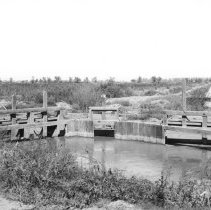 Holton Power Canal - Holtville. Headgate with wooden bridge in background.