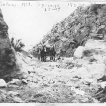 Wagon driving down the mountains below Mt. Springs grade.  Looks like he is