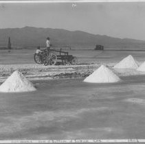 New Liverpool Salt Works - Men spreading salt. Small train & pumping tower