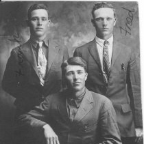 Studio portrait of three young men. Fred Williams is the man on the right.