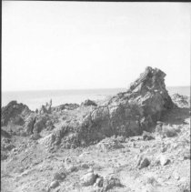 Mullet Island - Rocky terrain with Salton Sea in background.