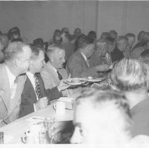 Group of men at a dinner includes Rodney Clark and Herbert Hughes