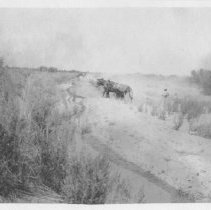 Construction of a canal. Men with scrapers.