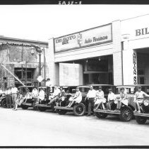 People sitting on cars lined up on El Centro Main St.,