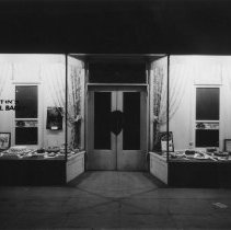 Exterior of Martin's National Bakery showing display windows